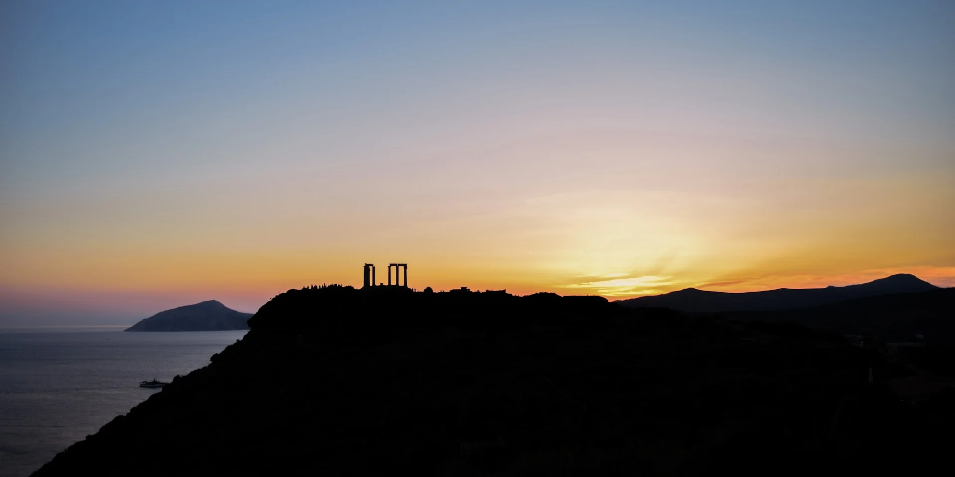 Temple of Poseidon at sunset in Sounion, Greece